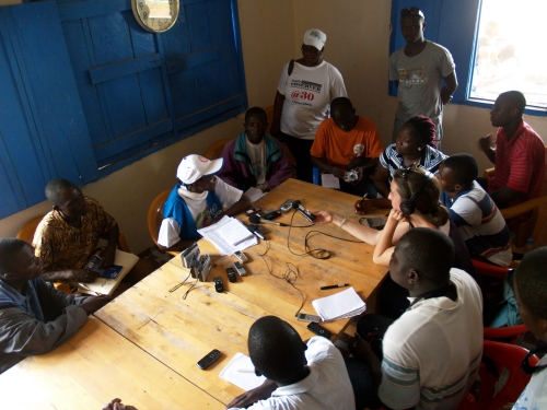 portrait of Jess Engebretson ’09 recording radio content in Liberia